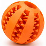7cm Yellow rubber dog ball showing a textured surface with raised nubs and curved grooves.