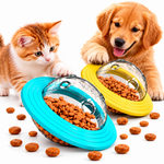 Golden retriever puppy and orange tabby kitten with blue and yellow pet treat dispensing toys filled with kibble on a clean white background