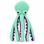 Petlivate plush octopus dog toy in mint and purple with a dog using the toy