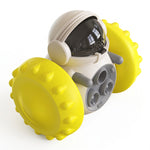 Petlivate yellow interactive treat dispensing pet toy with a white body, transparent lid and textured rolling wheels.
