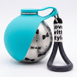 Blue portable dog water bottle with a stainless steel body decorated with black bow patterns and a black wrist strap.
